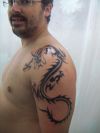 tribal dragon tats on shoulder